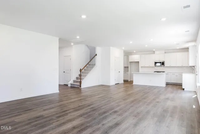 a view of a bathroom with two sinks and a window
