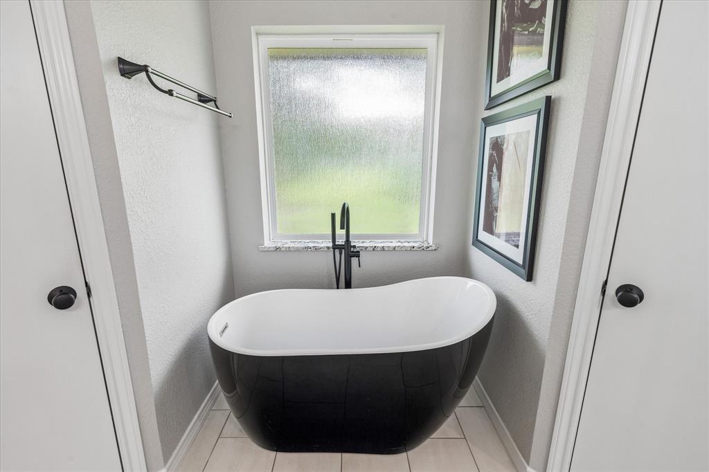 404 Moonlight Lane Keller, TX 76248 - Photo 24 of 40 a bathroom with a sink and a mirror