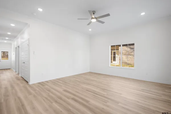 a view of an empty room with a window