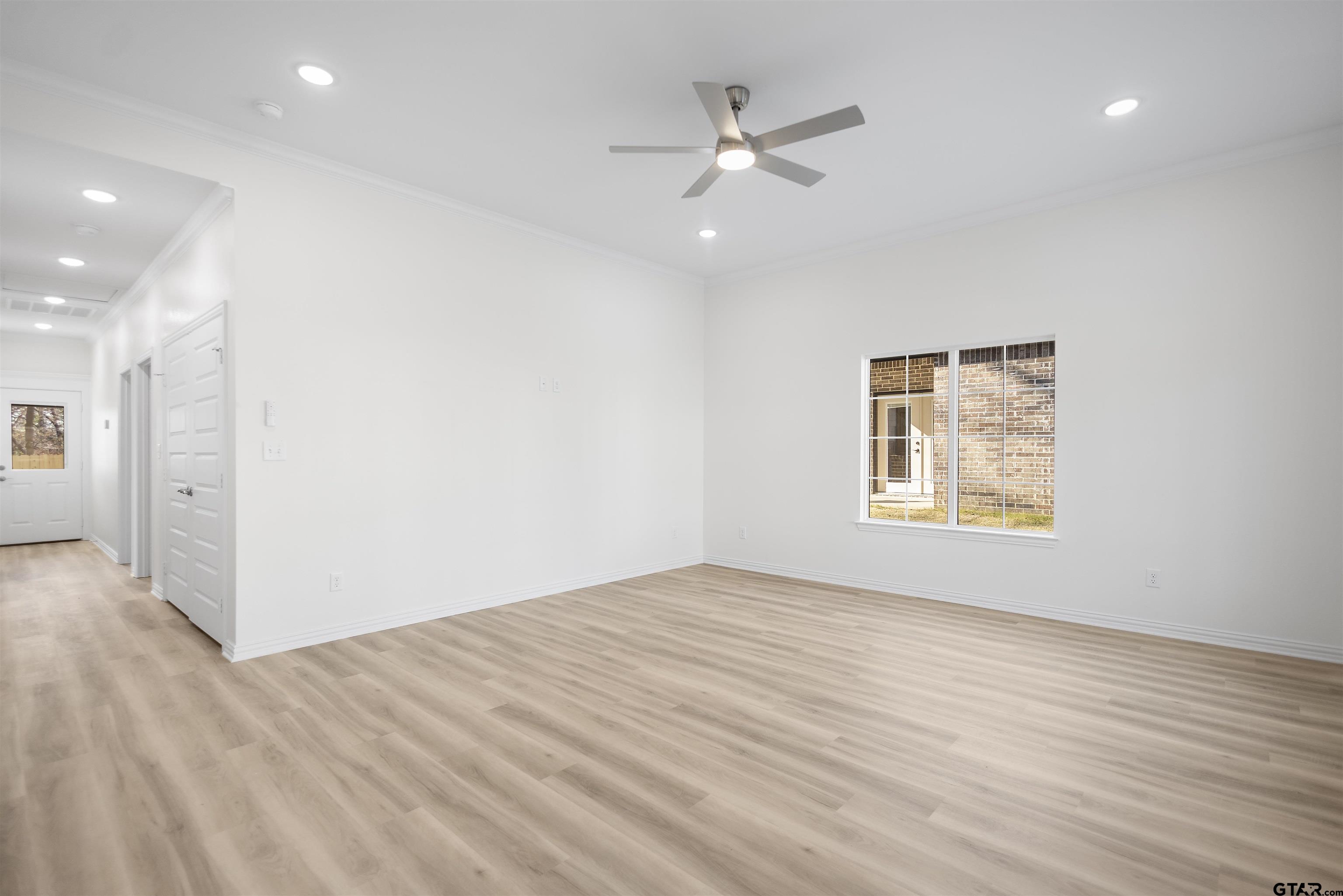1310 West Claude Street Tyler, TX 75702 - Photo 7 of 27 a view of an empty room with a window