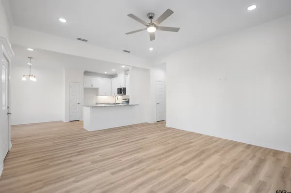 a view of kitchen with wooden floor and a kitchen