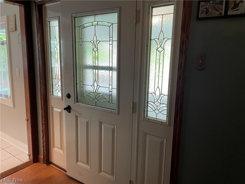 649 Neal Road Akron, OH 44312 - Photo 9 of 25 Newer entrance door with decorative glass
