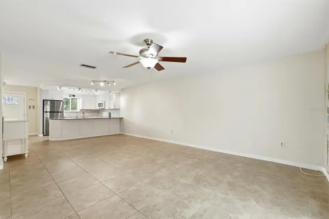 a view of a kitchen with marble kitchen and stainless steel appliances
