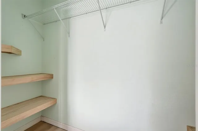 a white toilet sitting next to a shower