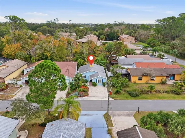 an aerial view of a house with a garden