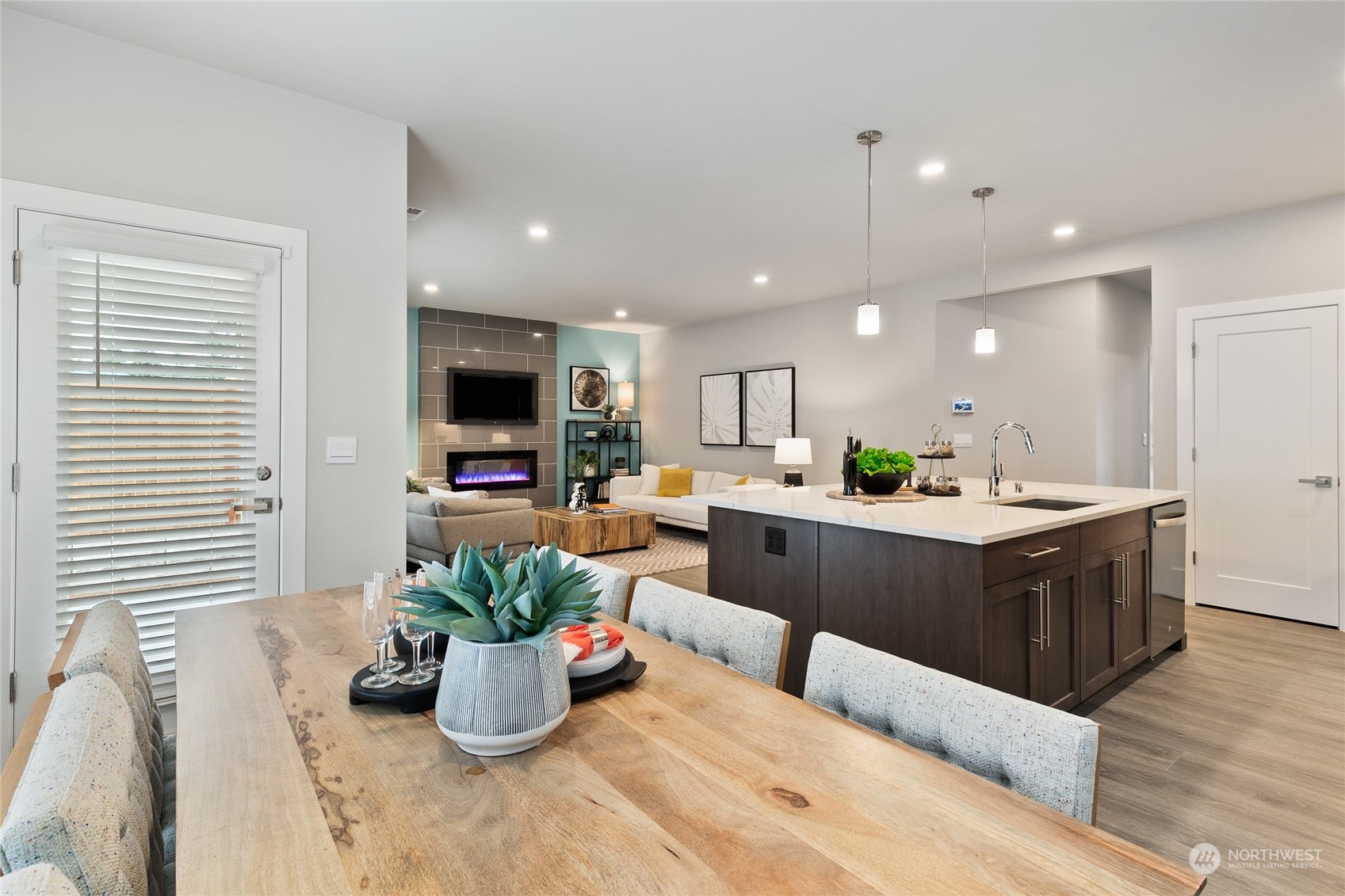 15 177th St S West, Unit IW 15 Bothell, WA 98012 - Photo 11 of 29 a living room with kitchen island furniture and a potted plant
