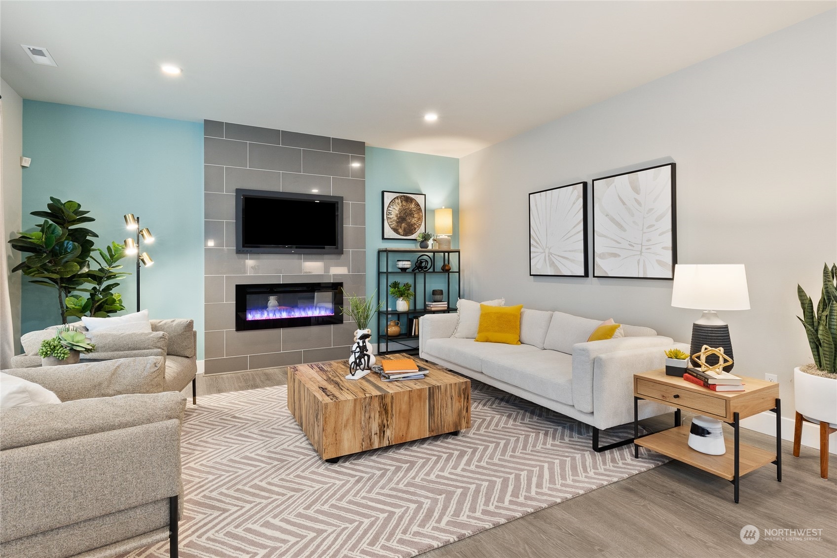 15 177th St S West, Unit IW 15 Bothell, WA 98012 - Photo 14 of 29 a living room with furniture a flat screen tv and a fireplace