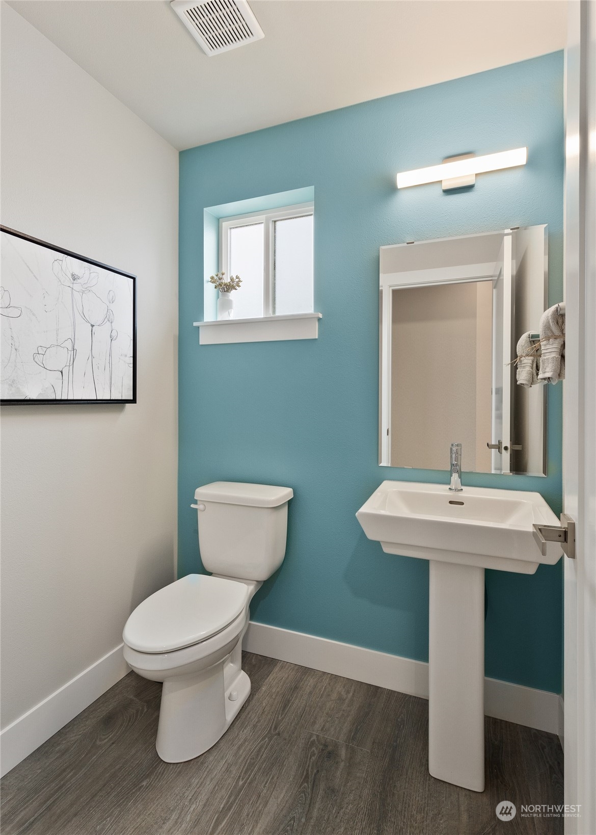 15 177th St S West, Unit IW 15 Bothell, WA 98012 - Photo 4 of 29 a bathroom with a toilet a sink and mirror