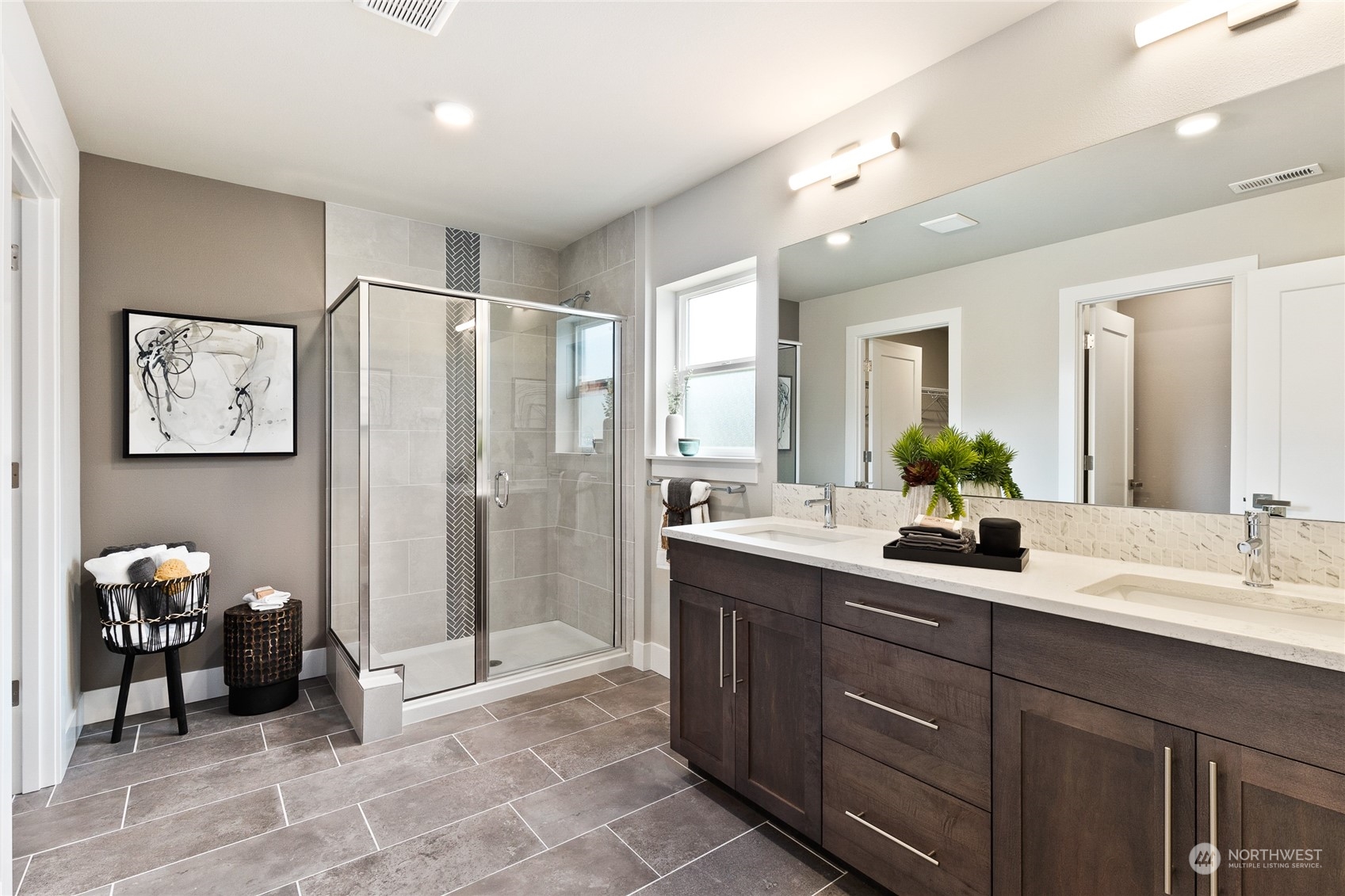 15 177th St S West, Unit IW 15 Bothell, WA 98012 - Photo 6 of 29 a spacious bathroom with a double vanity sink a mirror and a shower