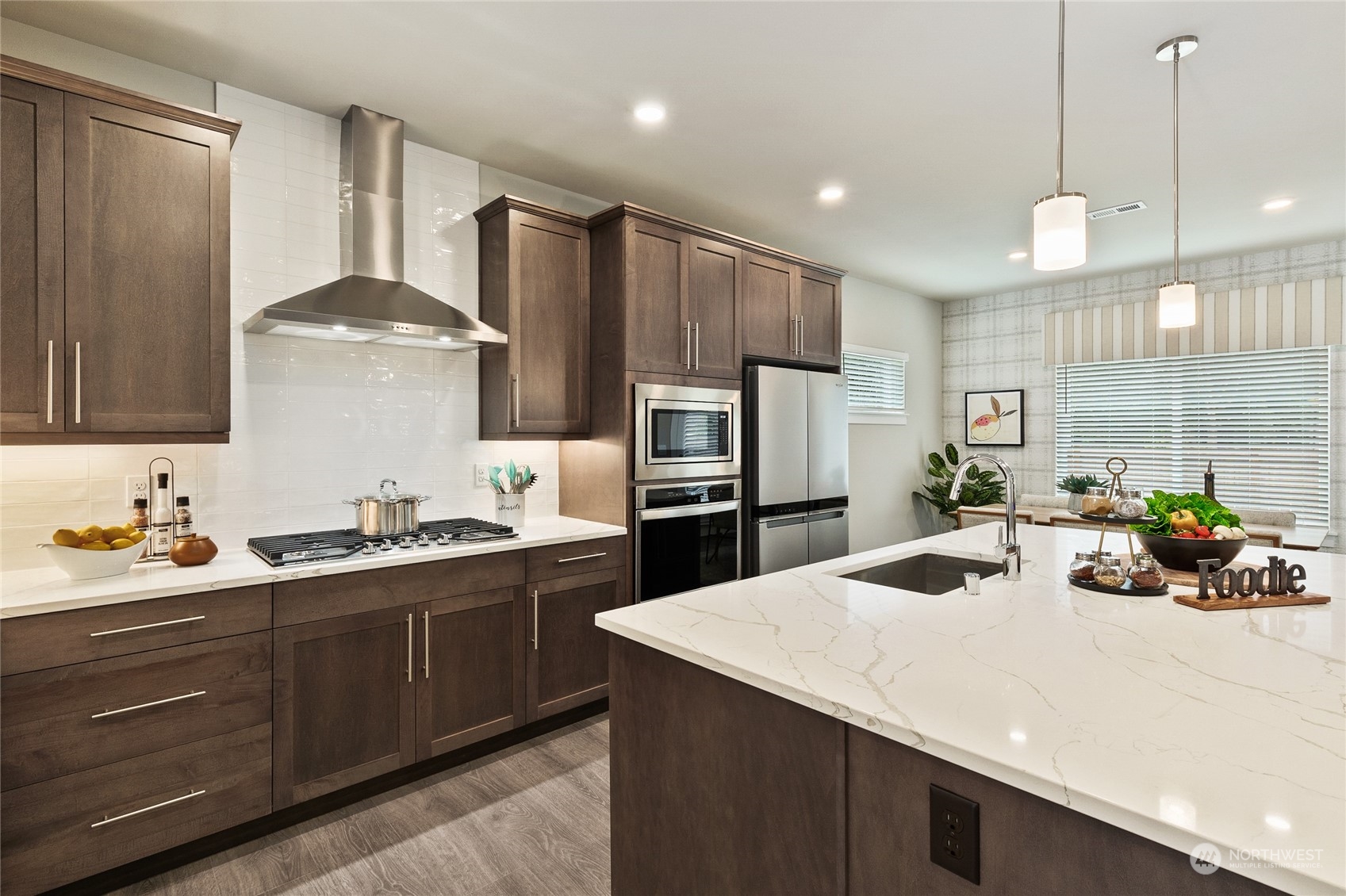 15 177th St S West, Unit IW 15 Bothell, WA 98012 - Photo 7 of 29 a kitchen with stainless steel appliances a sink stove and refrigerator