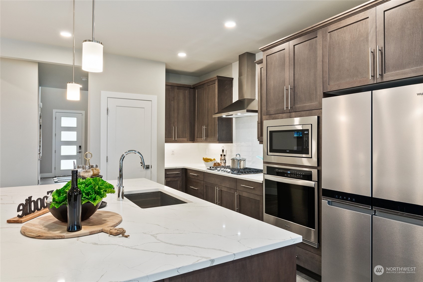 15 177th St S West, Unit IW 15 Bothell, WA 98012 - Photo 8 of 29 a kitchen with stainless steel appliances a sink refrigerator and microwave