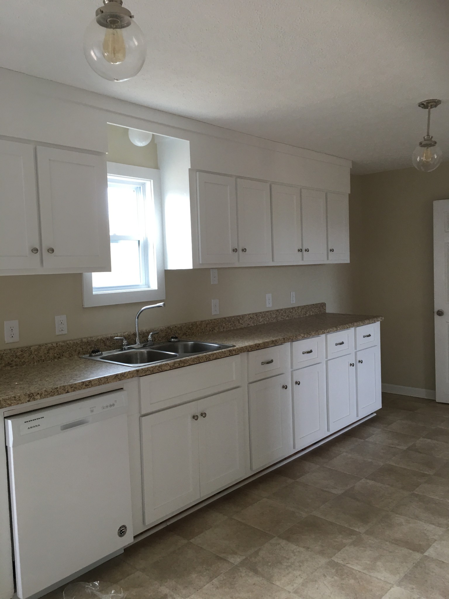 39 Orville Duke Road Morrison, TN 37357 - Photo 8 of 12 a kitchen with granite countertop white cabinets and a sink