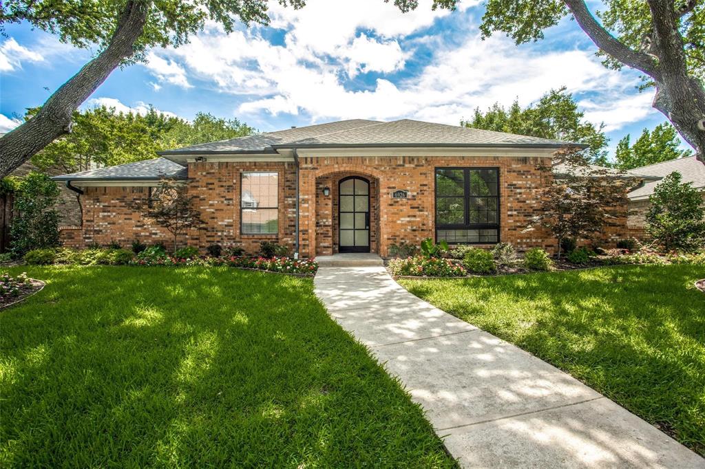 6926 Northwood Road Dallas, TX 75225 - Photo 2 of 29 a front view of a house with a garden and plants