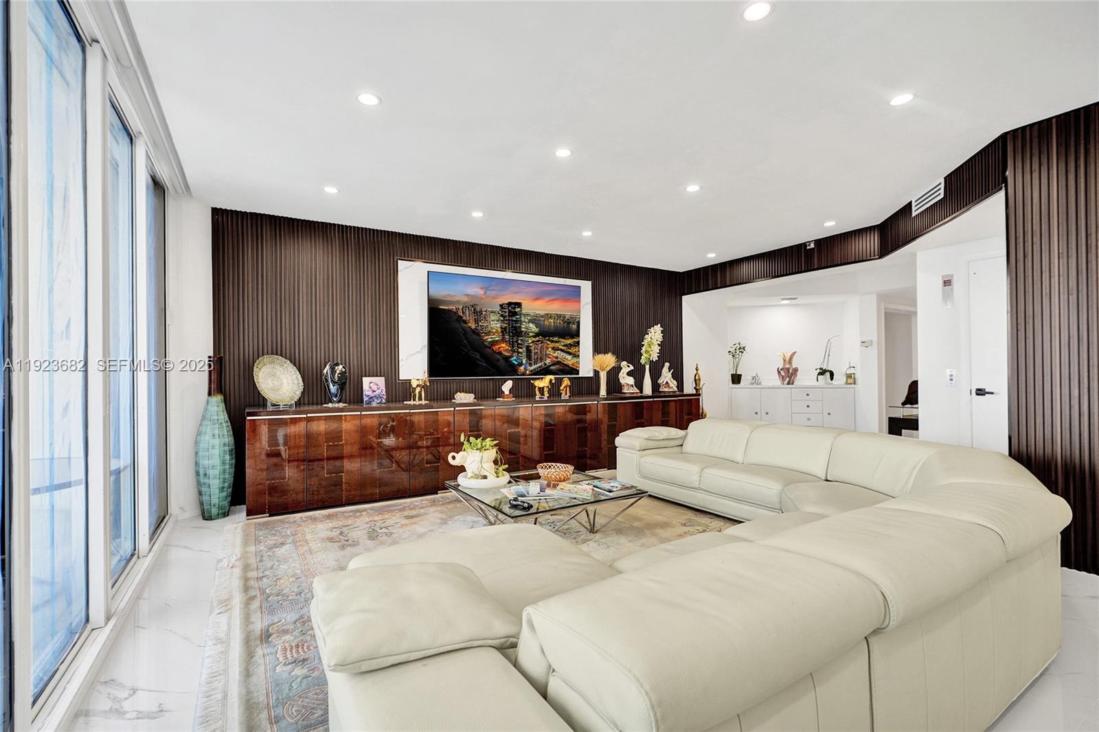 4000 Island Boulevard, Unit 2301 Aventura, FL 33160 - Photo 20 of 50 a large bedroom with a large bed and a large mirror