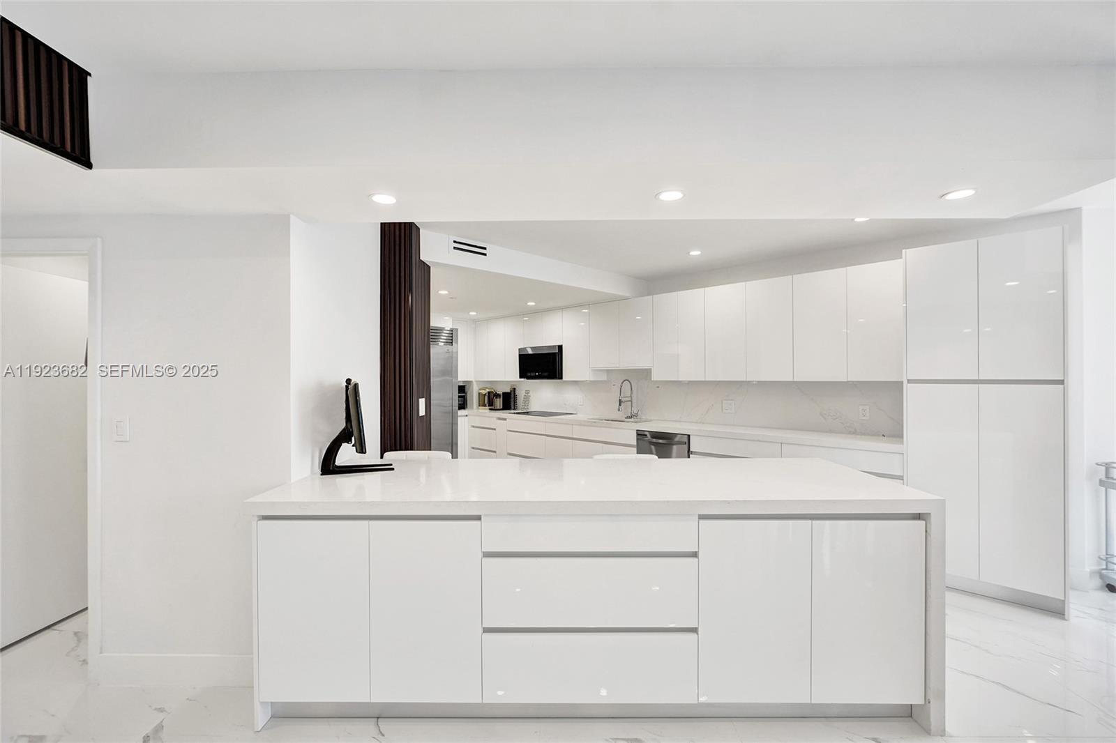 4000 Island Boulevard, Unit 2301 Aventura, FL 33160 - Photo 23 of 50 a bathroom with a sink and a mirror