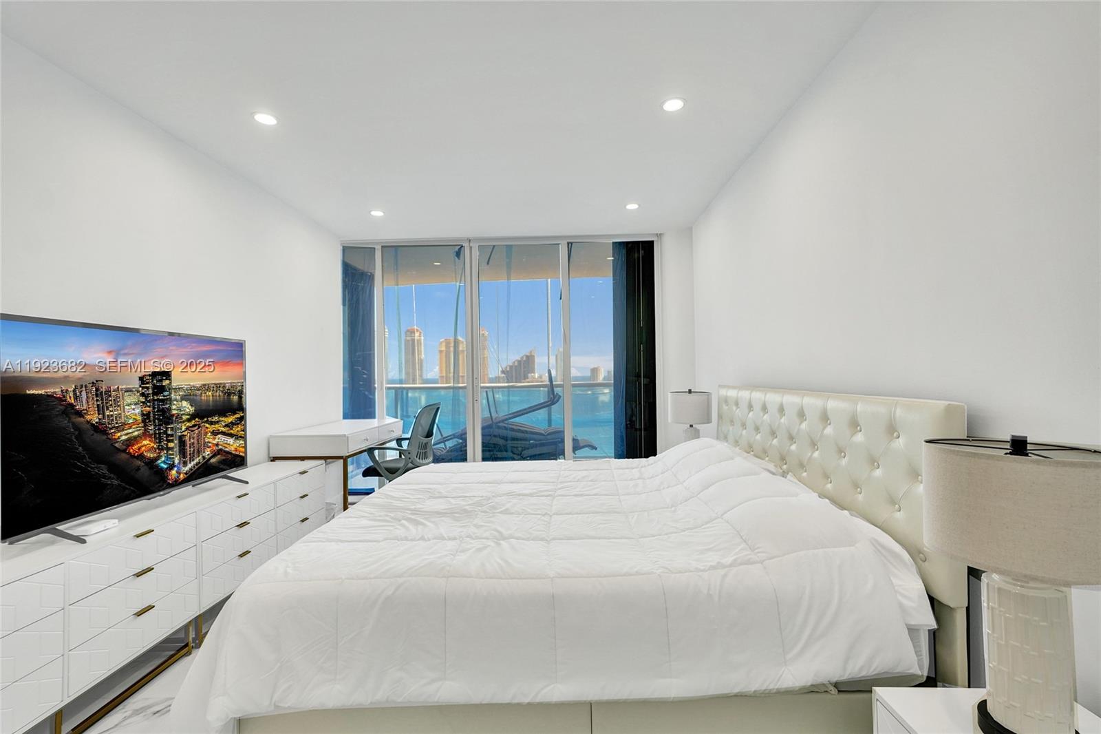 4000 Island Boulevard, Unit 2301 Aventura, FL 33160 - Photo 38 of 50 a large white bed in a white room