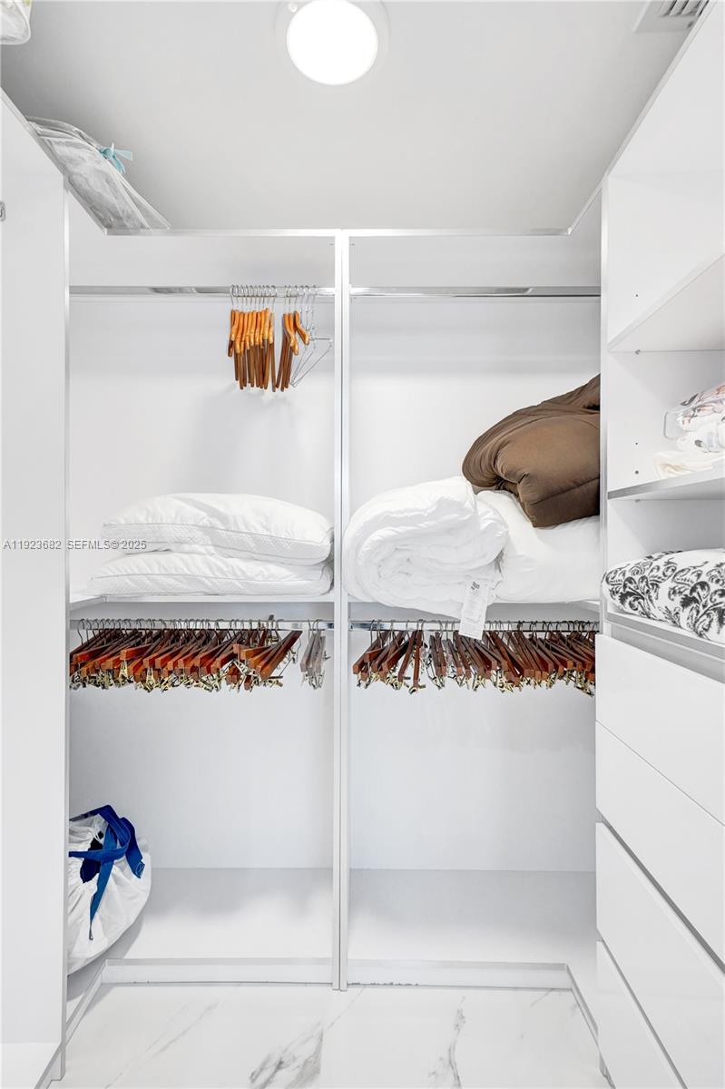 4000 Island Boulevard, Unit 2301 Aventura, FL 33160 - Photo 42 of 50 a view of a closet area