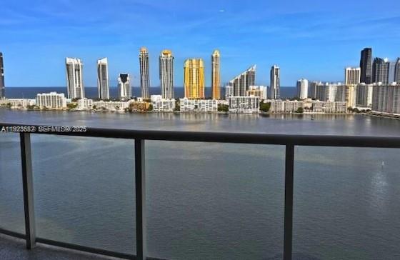 4000 Island Boulevard, Unit 2301 Aventura, FL 33160 - Photo 50 of 50 a kitchen with a sink and a wooden floor