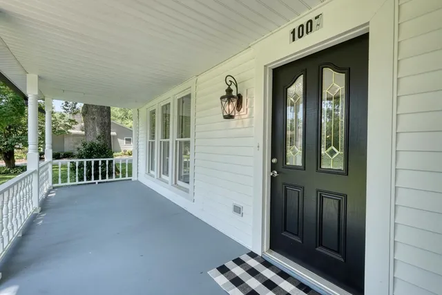 a view of a porch of a house