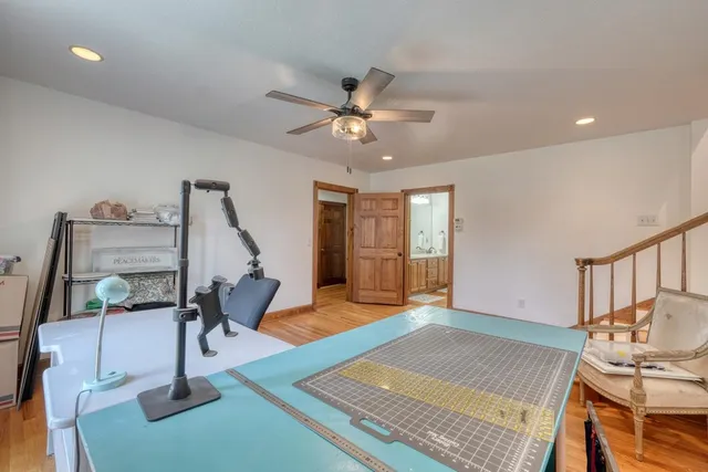 a bathroom with a tub and a window