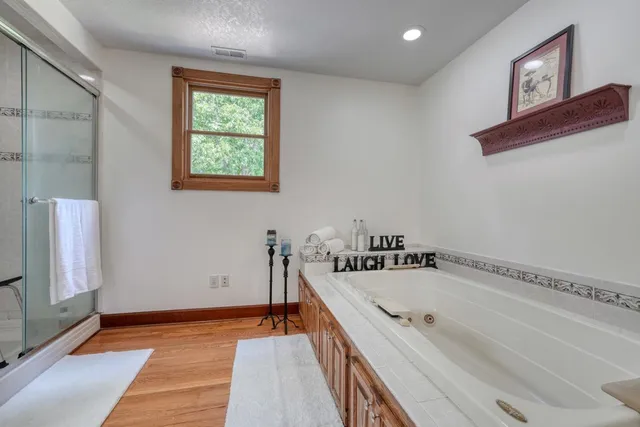 a bedroom with furniture and a window