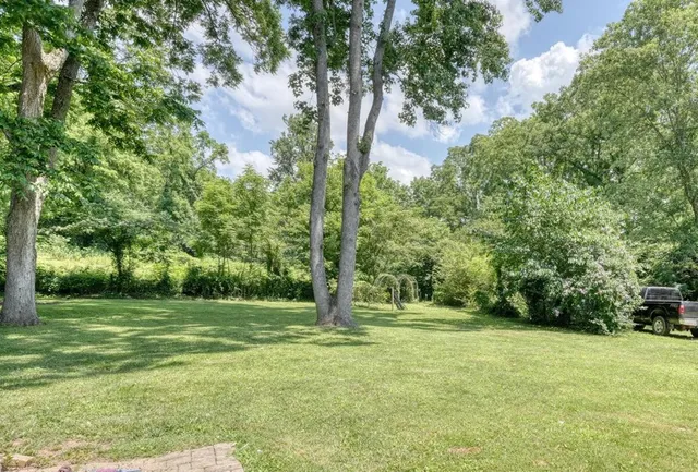 a house with trees in the background