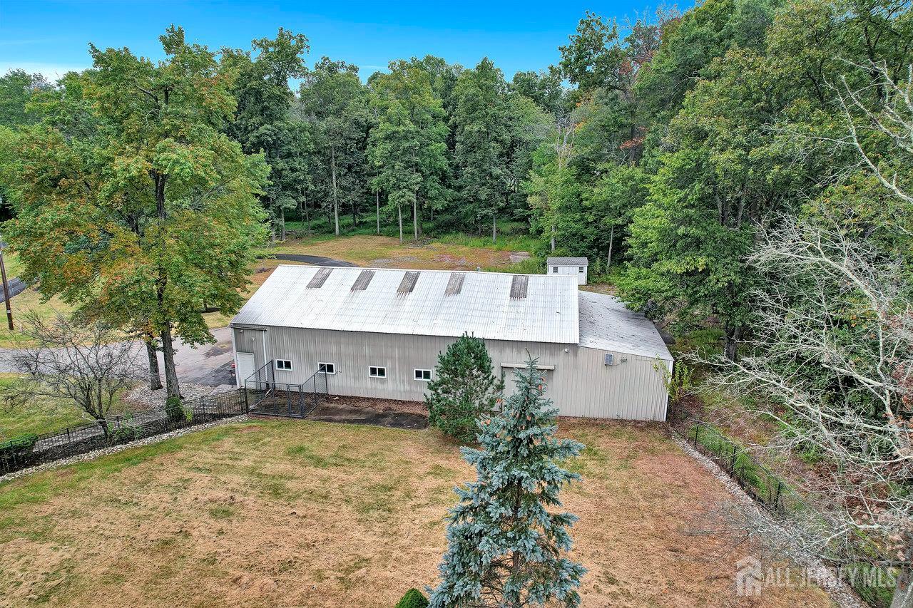 526 County Road, Unit 579 Ringoes, NJ 08551 - Photo 13 of 51 a view of a house with a yard and large trees
