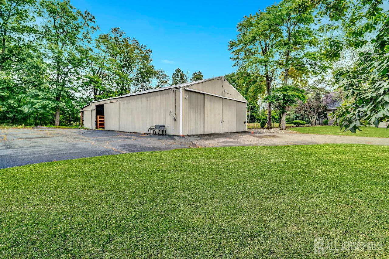 526 County Road, Unit 579 Ringoes, NJ 08551 - Photo 21 of 51 a backyard of a house with lots of green space