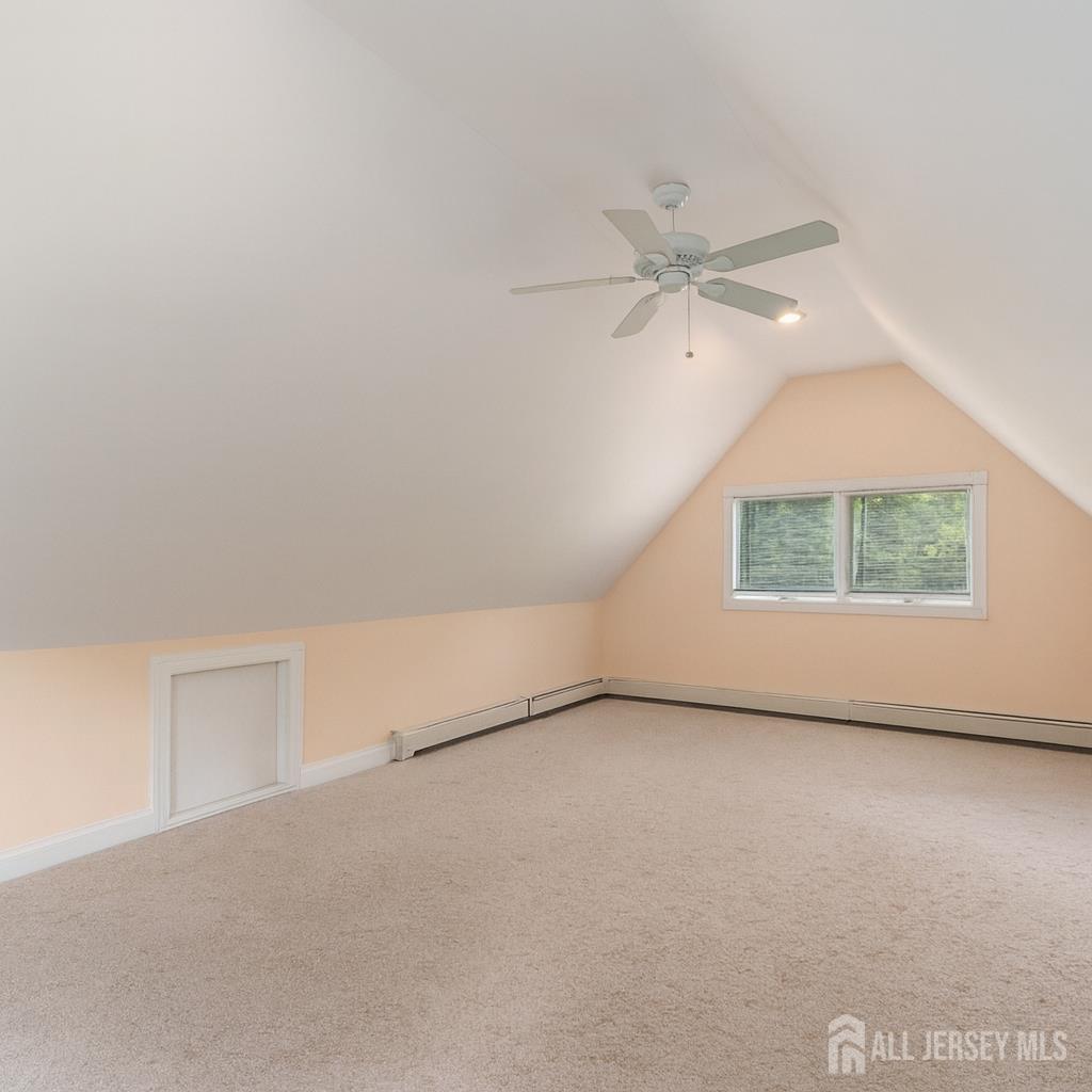 526 County Road, Unit 579 Ringoes, NJ 08551 - Photo 43 of 51 an empty room with a window and a ceiling fan