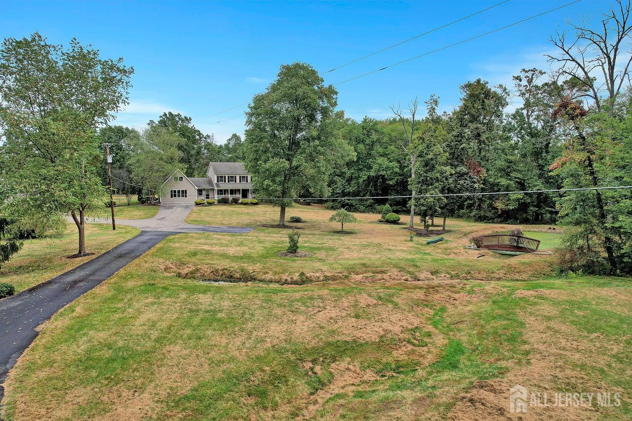 526 County Road, Unit 579 Ringoes, NJ 08551 - Photo 7 of 51 a swimming pool with trees in the background