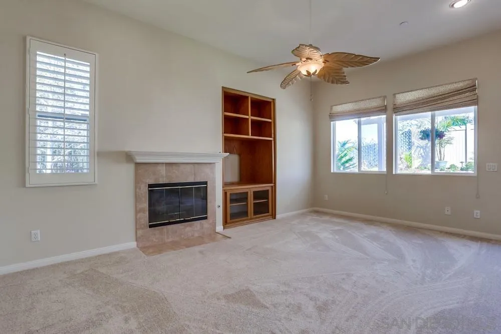 710 Greyfield Court Fallbrook, CA 92028 - Photo 14 of 28 a view of an empty room with a window and fireplace