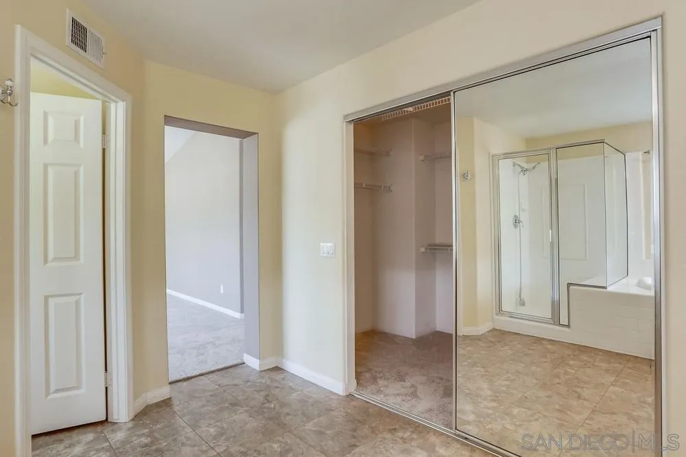 710 Greyfield Court Fallbrook, CA 92028 - Photo 19 of 28 an empty room that has a wooden cupboard