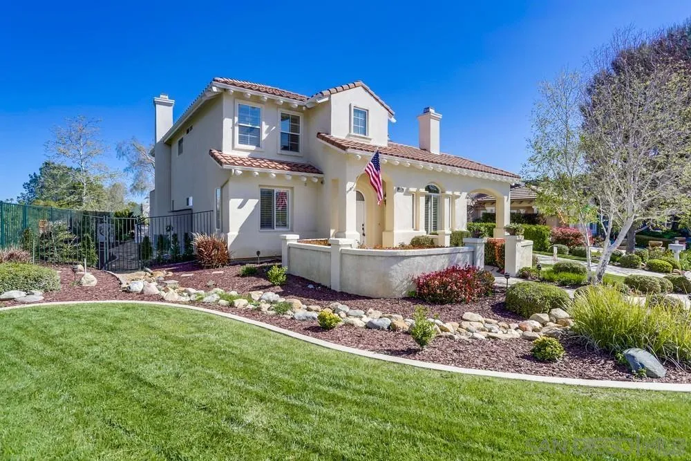 710 Greyfield Court Fallbrook, CA 92028 - Photo 3 of 28 a front view of a house with a garden