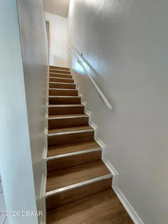 a view of a swimming pool with a garden and plants
