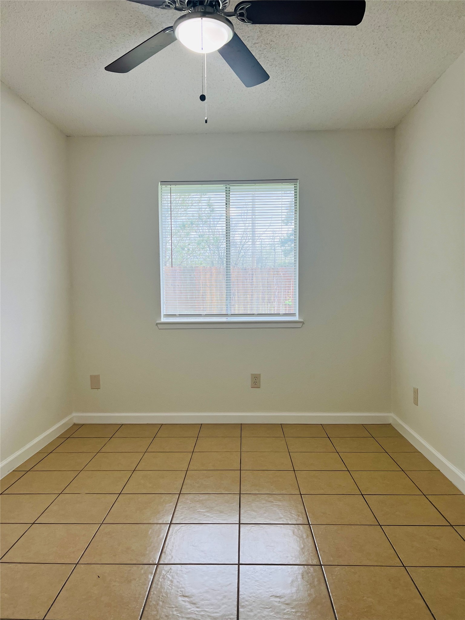 3739 Varla Lane Houston, TX 77014 - Photo 23 of 33 a view of a room with tiles and a window