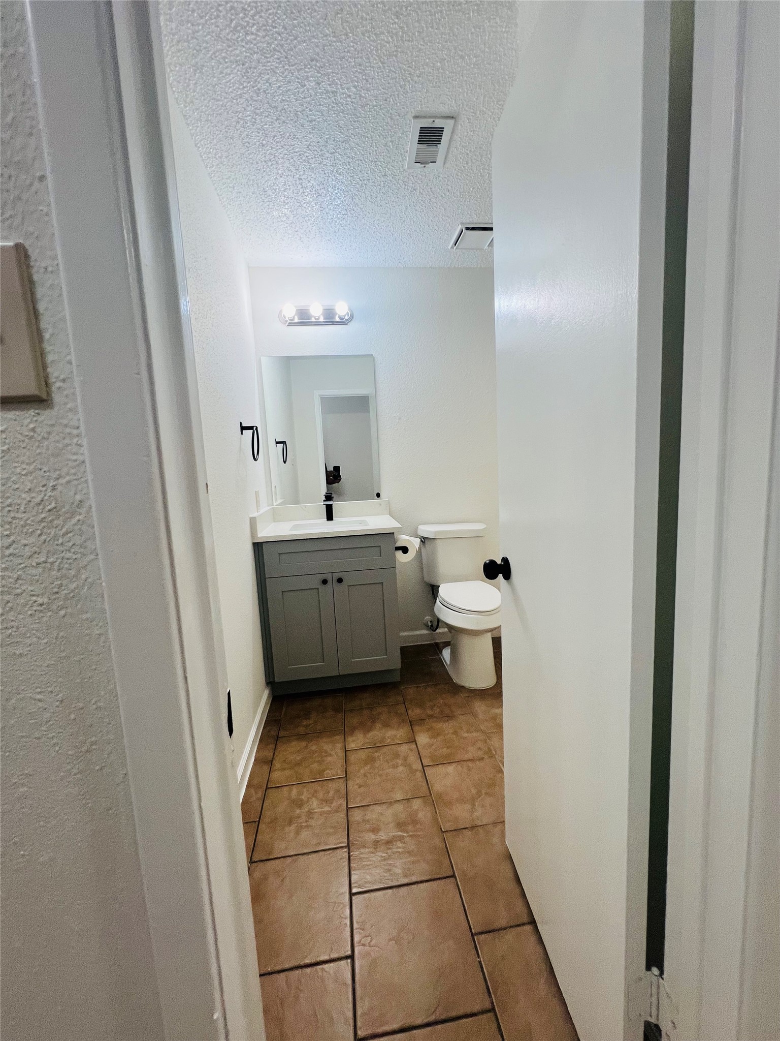 3739 Varla Lane Houston, TX 77014 - Photo 24 of 33 a bathroom with a sink a toilet and mirror