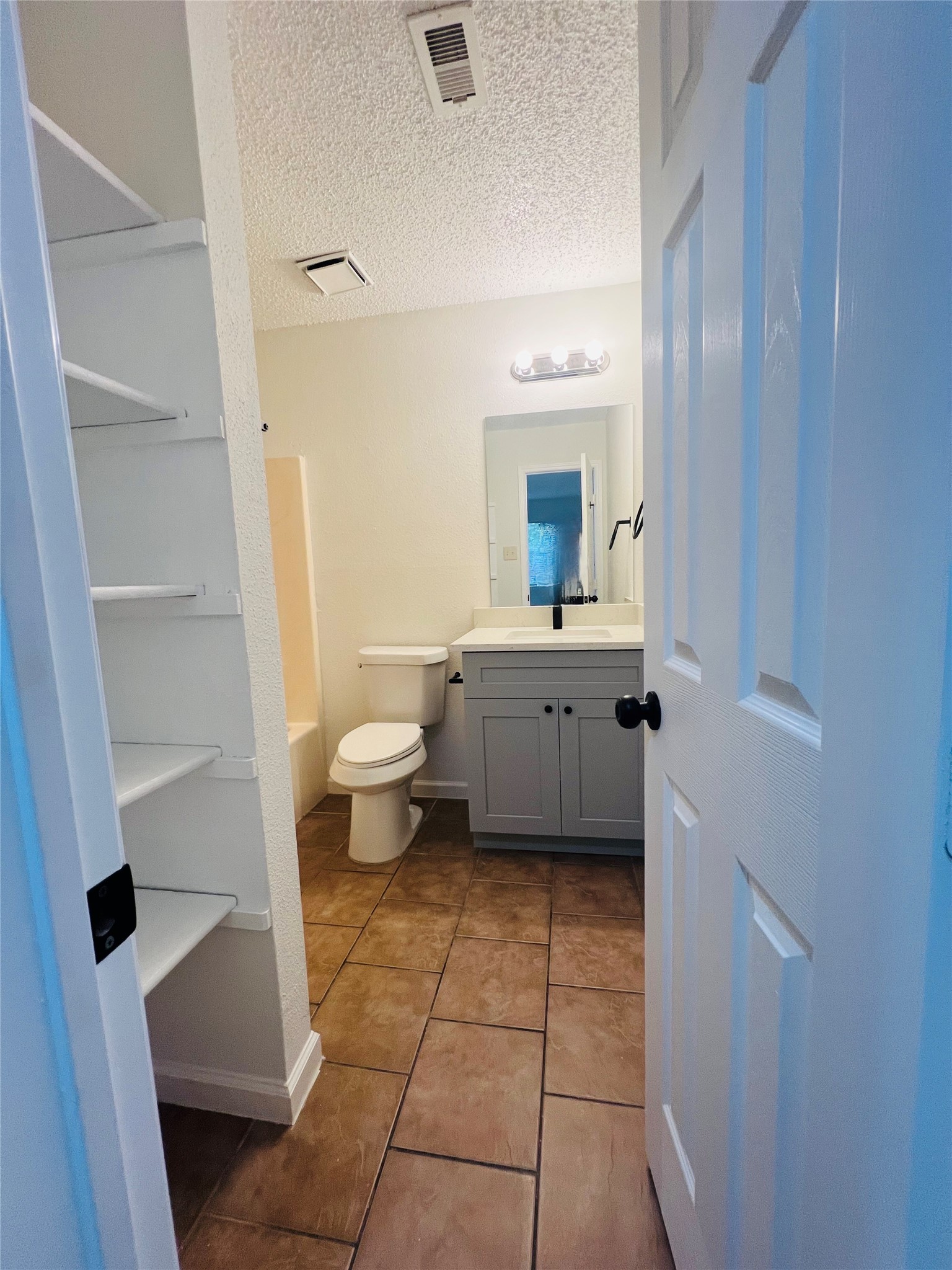 3739 Varla Lane Houston, TX 77014 - Photo 25 of 33 a bathroom with a sink a toilet and a mirror