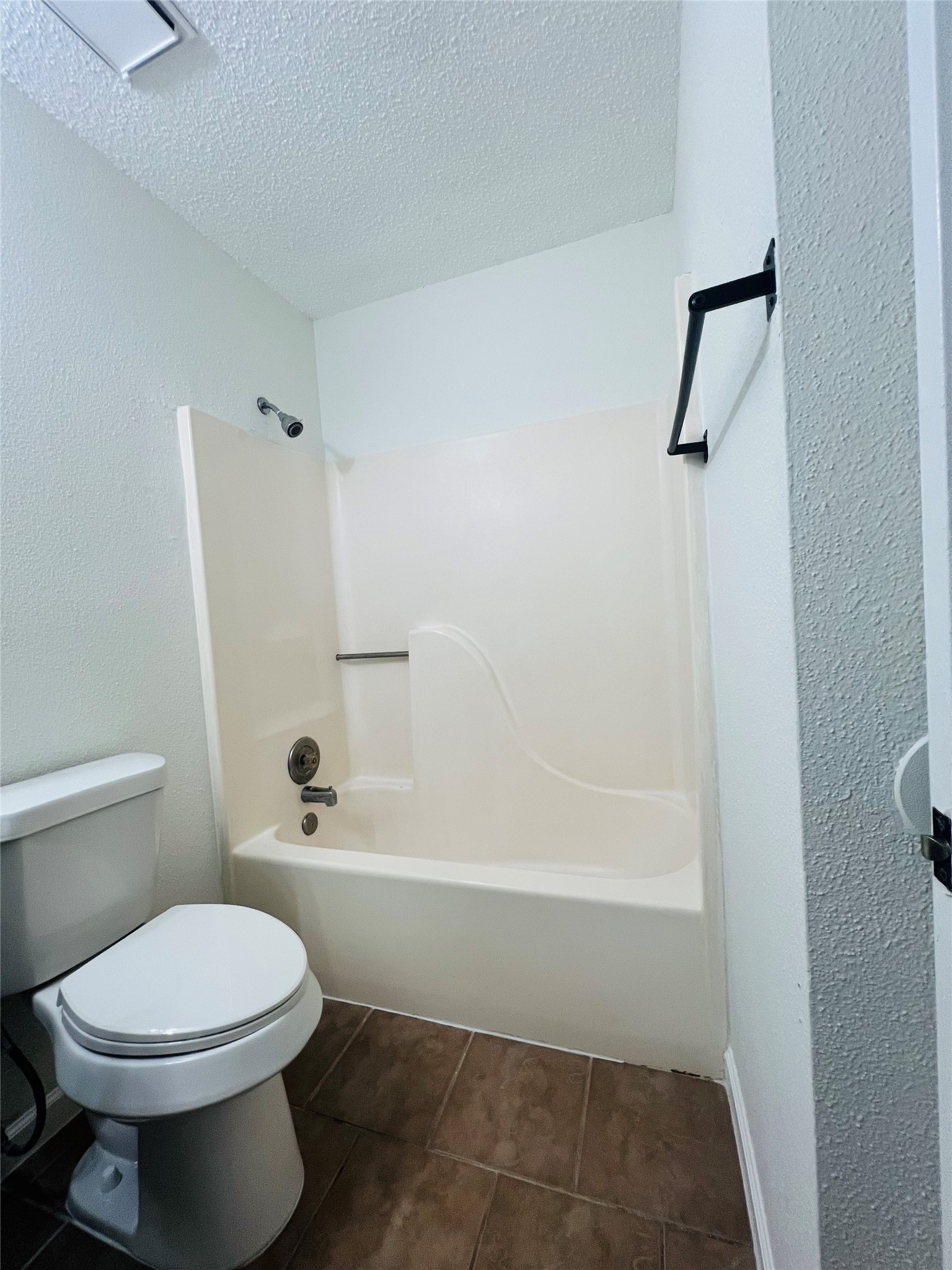 3739 Varla Lane Houston, TX 77014 - Photo 27 of 33 a bathroom with a toilet and a bath tub