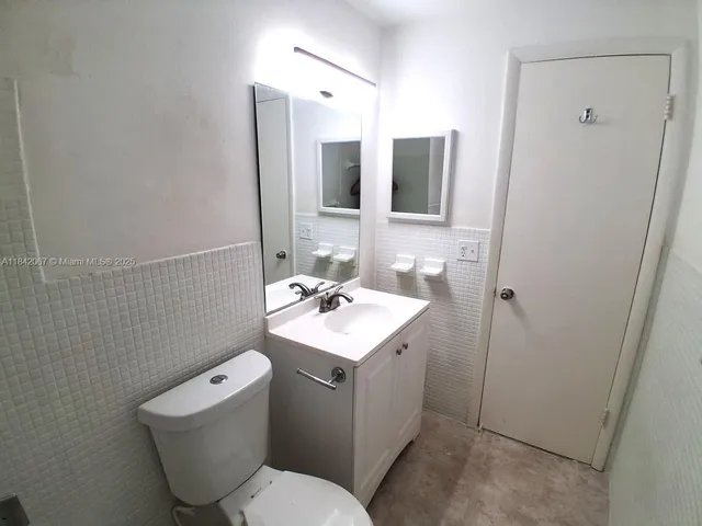 a bathroom with a sink toilet and bathtub