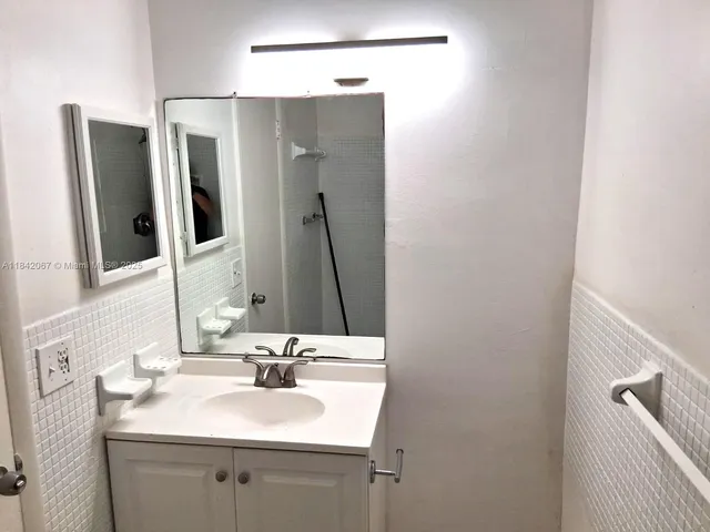 a bathroom with a shower and a toilet