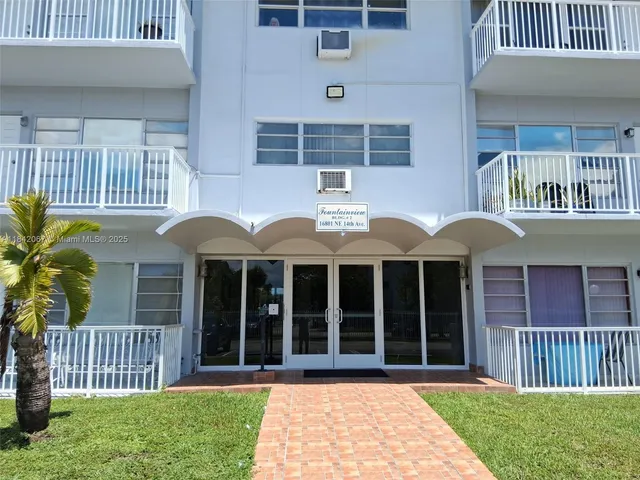 a view of a balcony with wooden floor and city view