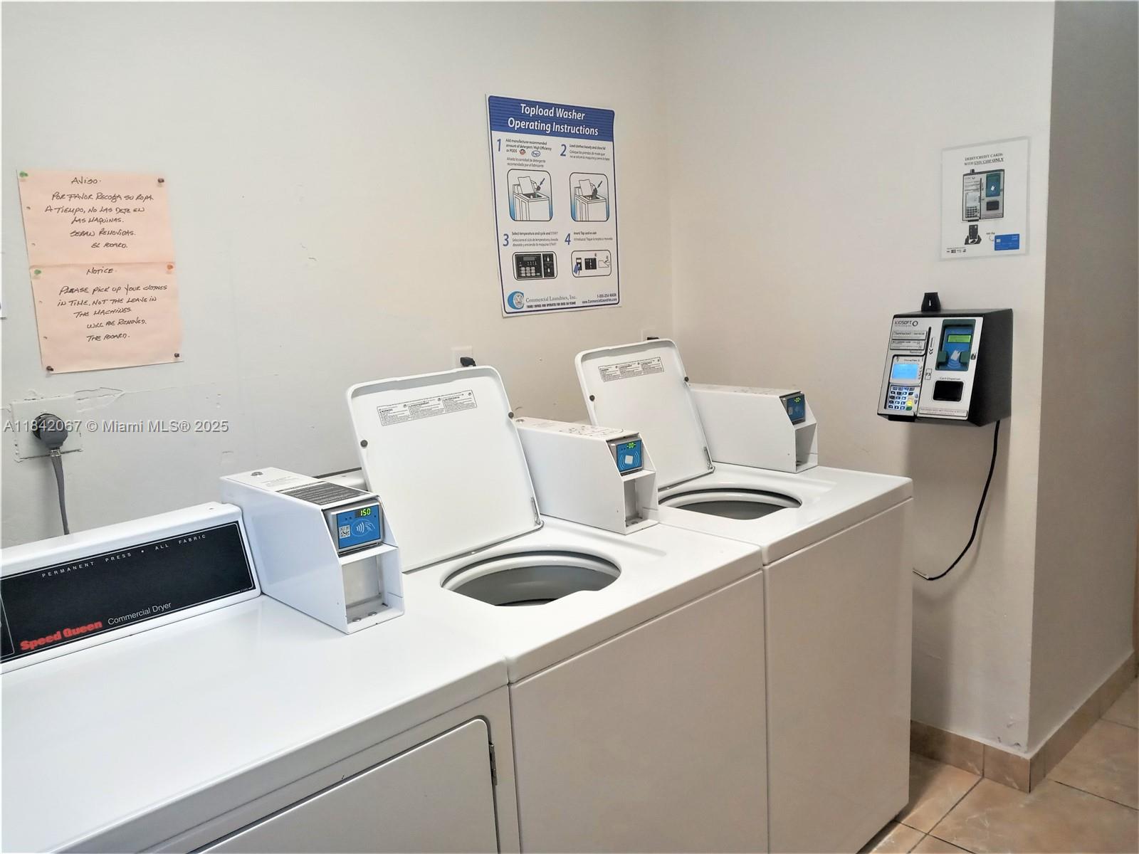 16801 Northeast 14th Avenue, Unit 209 Miami, FL 33162 - Photo 26 of 28 a utility room with dryer and washer