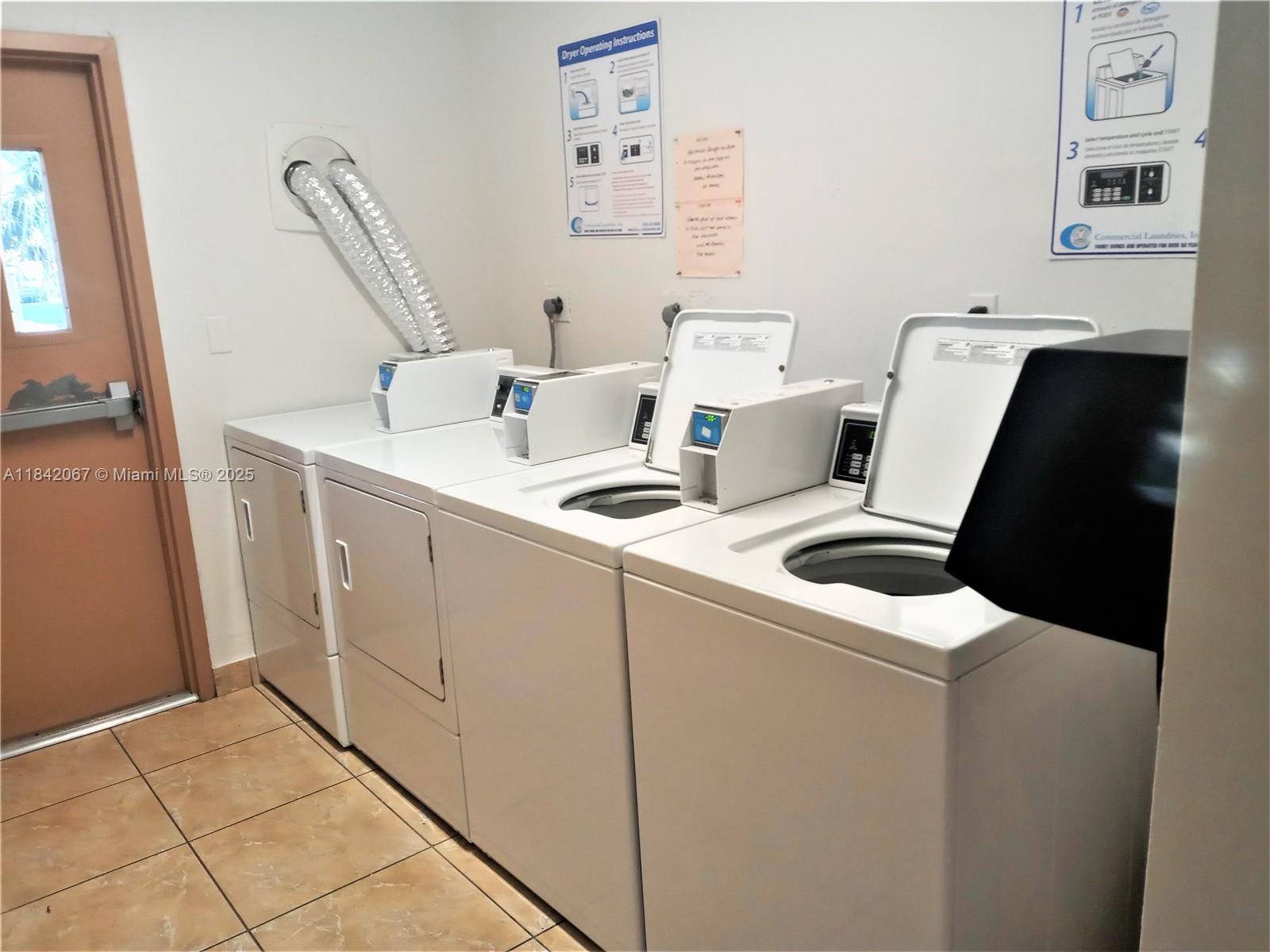 16801 Northeast 14th Avenue, Unit 209 Miami, FL 33162 - Photo 27 of 28 a utility room with dryer and washer