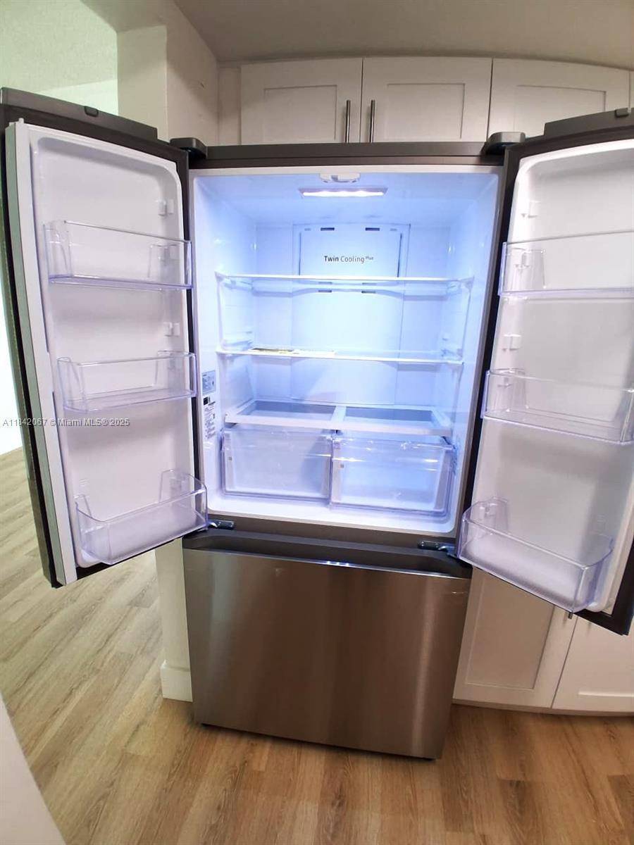 16801 Northeast 14th Avenue, Unit 209 Miami, FL 33162 - Photo 9 of 28 a close view of closet