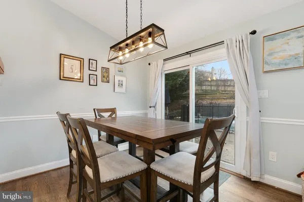 a view of a dining table and chairs in the room
