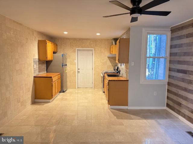 5547 Broomall Street Philadelphia, PA 19143 - Photo 11 of 17 a kitchen with a refrigerator and a sink
