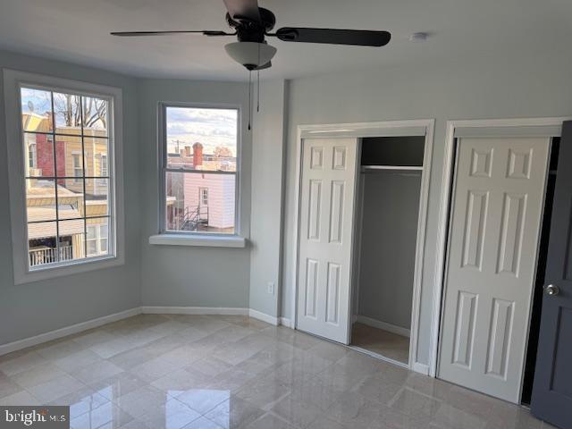 5547 Broomall Street Philadelphia, PA 19143 - Photo 12 of 17 a view of empty room with window and ceiling fan