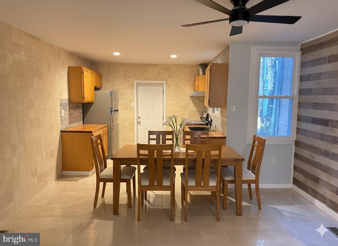 5547 Broomall Street Philadelphia, PA 19143 - Photo 15 of 17 a view of a dining room with furniture