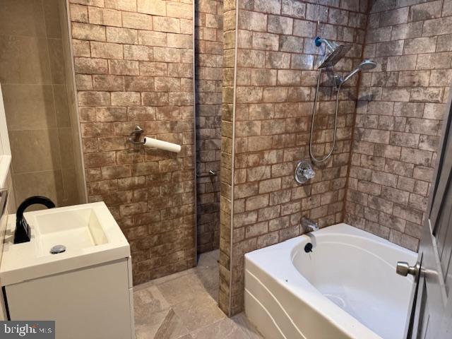 5547 Broomall Street Philadelphia, PA 19143 - Photo 6 of 17 a bathroom with a sink and a bathtub