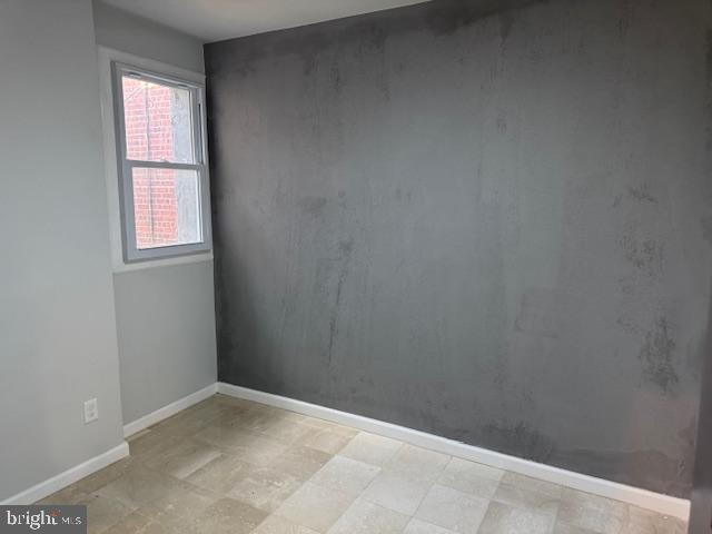 5547 Broomall Street Philadelphia, PA 19143 - Photo 8 of 17 a view of an empty room with a window